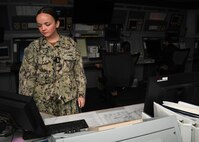 Chief Air Traffic Controller Kristen Costlow stands Facility and Radar supervisor Watch in the NAS Patuxent River Radar room May 30. Costlow was part of an all-women air traffic control crew at NAS Patuxent River, standing watch at nine posts between the tower, Flight Planning, and Radar.