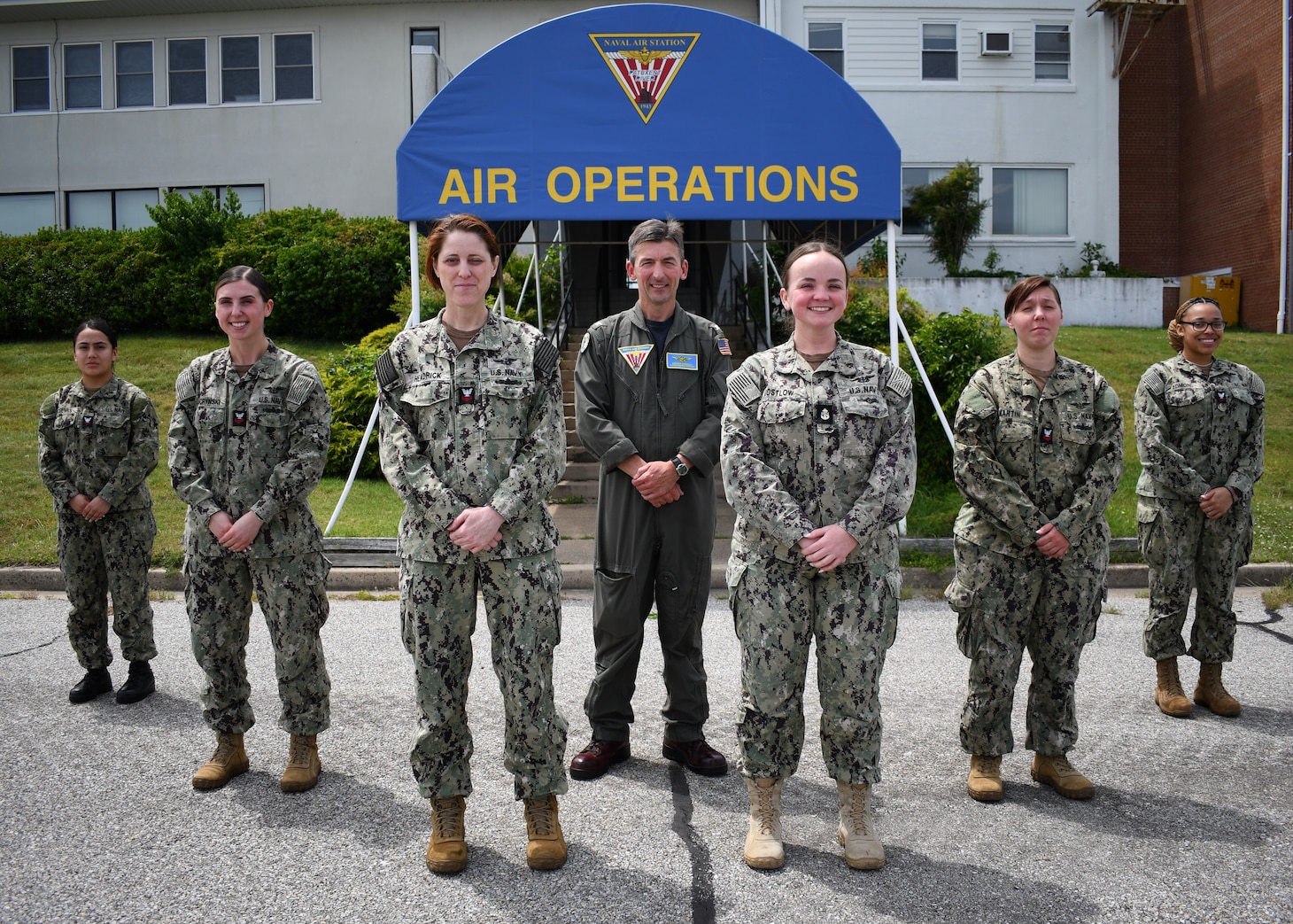 NAS Patuxent River Commanding Officer Capt. Derrick Kingsley, center, stands with members of the first all-women air traffic control crew at NAS Patuxent River May 30. From left, Air Traffic Controller 2nd Class Syrenia Cuevas, Air Traffic Controller 1st Class Kristy Lescrynski, Air Traffic Controller 1st Class Erica Headrick, Chief Air Traffic Controller Kristen Costlow, Air Traffic Controller 1st Class Talyssa Martin, and Air Traffic Controller 2nd Class Tieraney Edmond were all members of this historic team, which stood watches between the Pax River Air Traffic Control Tower, Flight Planning, and Radar.