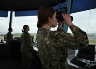 From right, Air Traffic Controller 2nd Class Brianna Boore, Air Traffic Controller 1st Class Amanda Galentine, and Air Traffic Controller 1st Class Talyssa Martin stand watch in the NAS Patuxent River Air Traffic Control Tower May 30. The three Sailors were part of an all-women air traffic control crew at NAS Patuxent River, standing watch at nine posts between the tower, Flight Planning, and Radar.