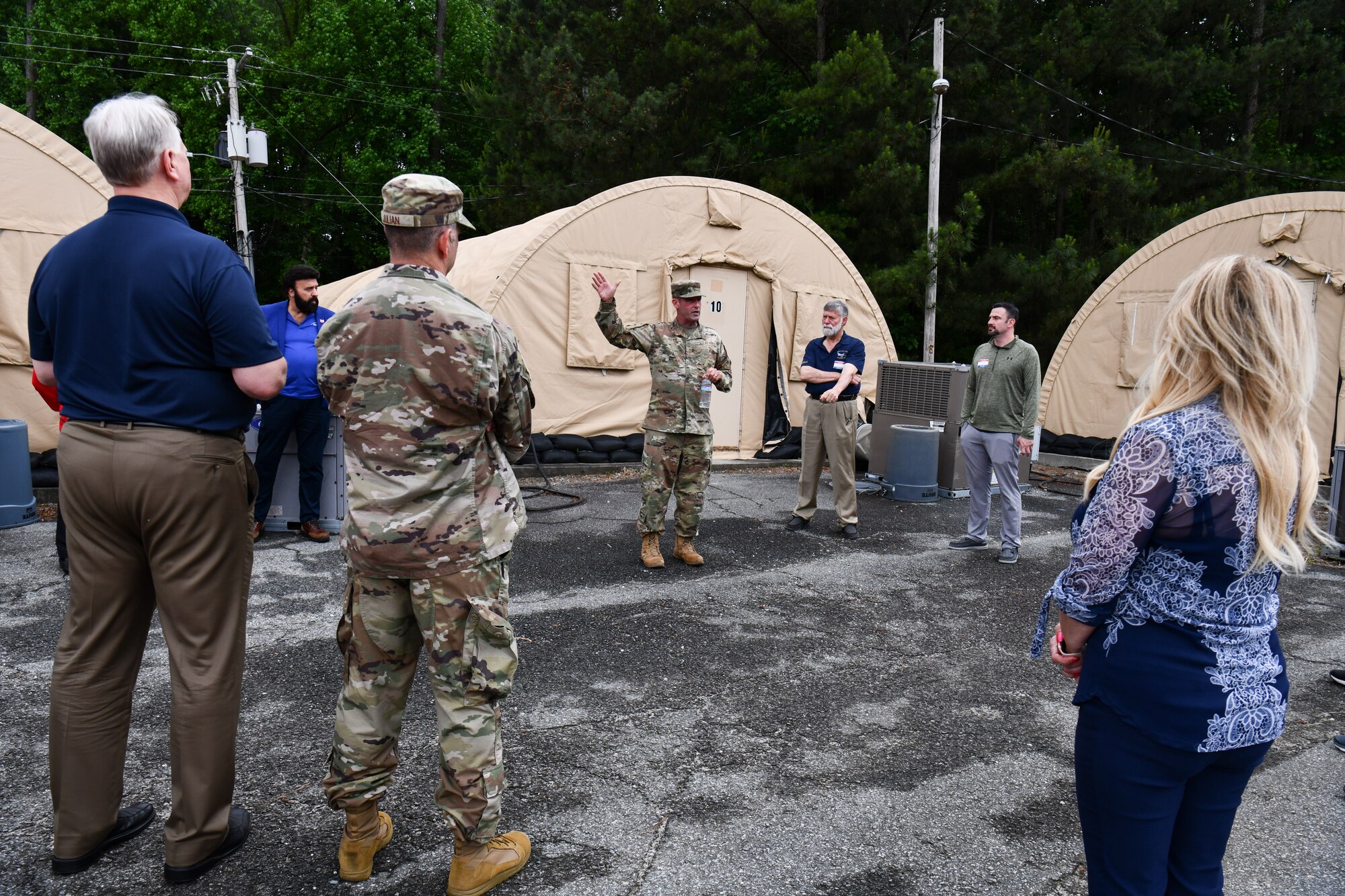 Chief Master Sgt. Bryon Godwin, force support silver flag superintendent assigned to the 622nd Training Squadron, explains the deployed military living environment to participants of the 910th Airlift Wing’s civic leader tour to Dobbins Air Reserve Base, Georgia, May 12, 2023.