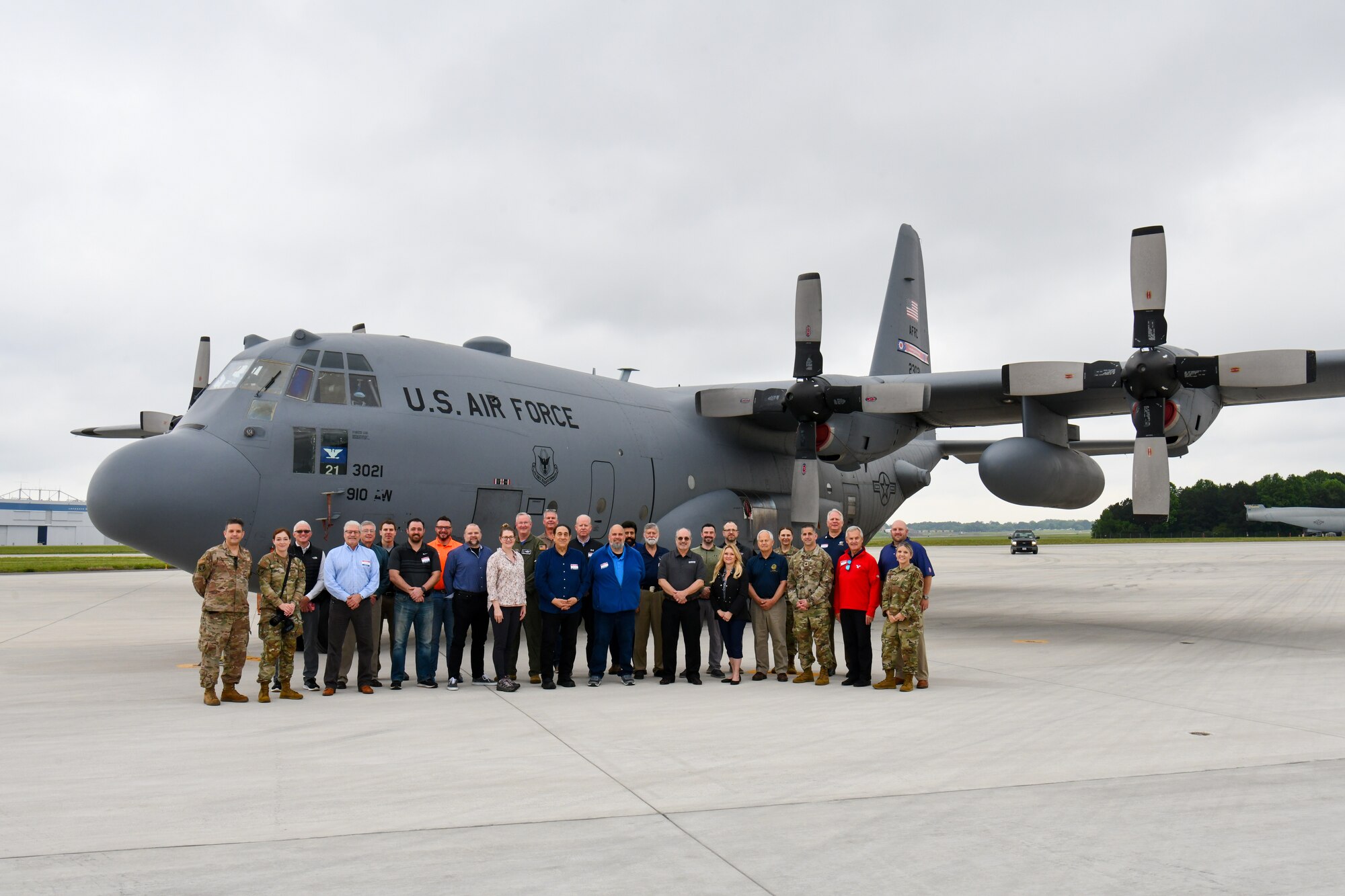 Participants in the 910th Airlift Wing’s civic leader tour to Dobbins Air Reserve Base, Georgia, pose for a photo in front of a 910th C-130H Hercules aircraft at Dobbins ARB, May 12, 2023.