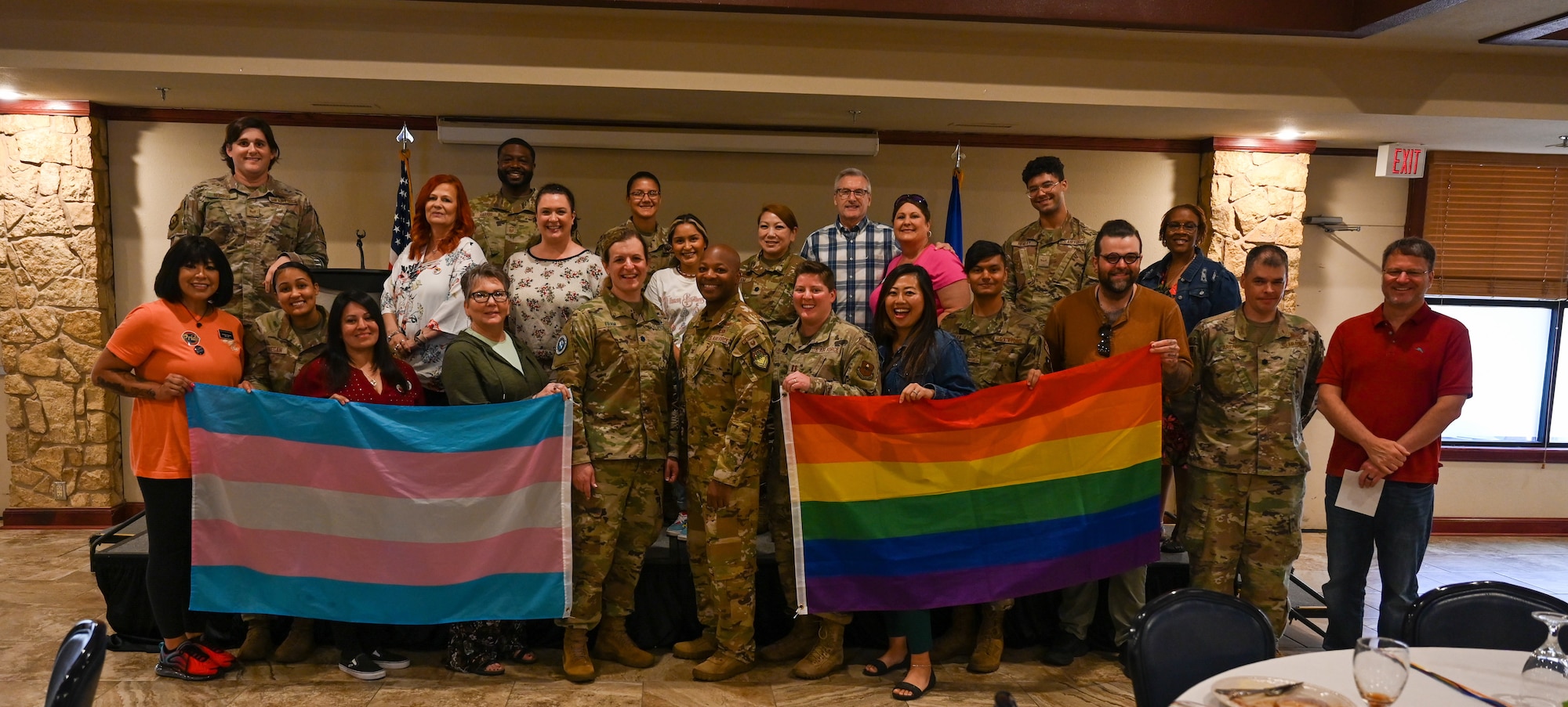 Members of the Altus Air Force Base LGBTQ+, Allies Pride Team, and 97th Air Mobility Wing leadership pose for a photo with U.S. Space Force Lt. Col. Bree Fram, astronautical engineer, during a Pride Month event held on base, June 5, 2023. Currently, 6.1% of military service members identify as LGBTQ+. (U.S. Air Force photo by Airman 1st Class Heidi Bucins).