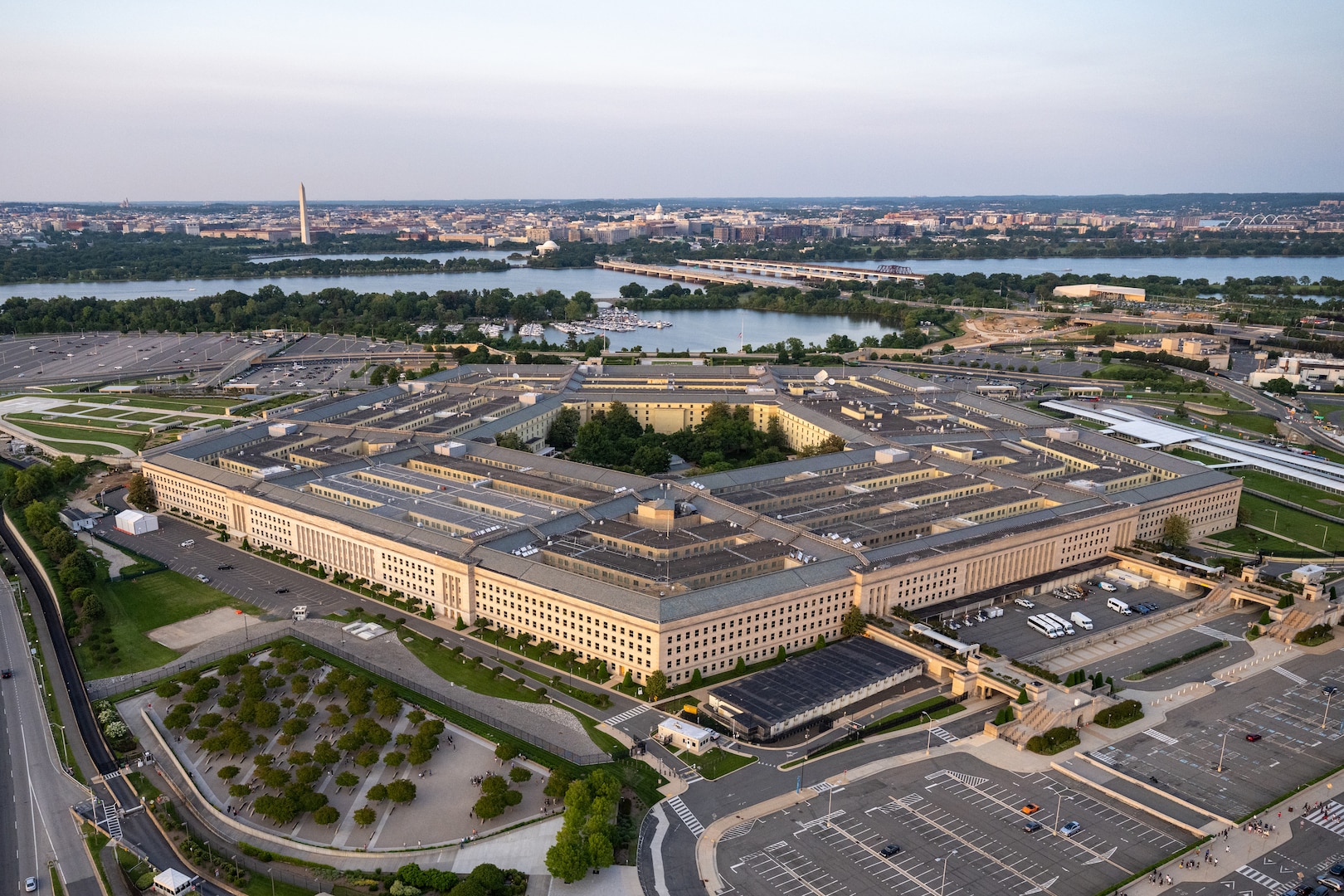 An aerial view of the Pentagon with the Washington Monument in the background.