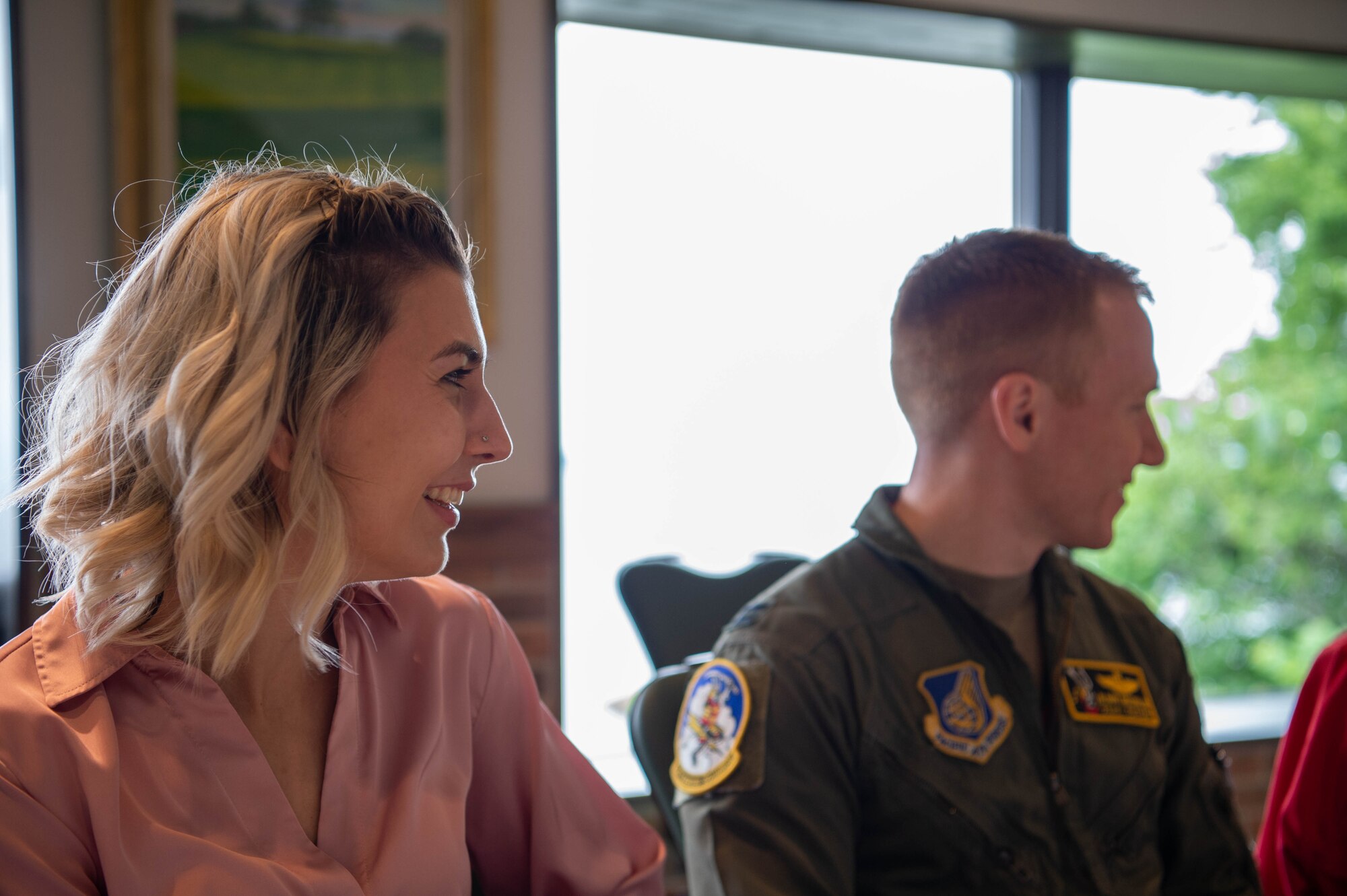 Military spouse Tiffini Grochalski, sits at the table with her husband Capt. Robert Grochalski.