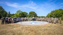 PUTLOS, Germany (June 5, 2023) Service members from NATO Allied nations participating in Exercise Baltic Operations (BALTOPS) 23 pose for a photograph at the Bundeswehr military training area in Putlos, Germany. BALTOPS 23 is the premier maritime-focused exercise in the Baltic Region. The exercise, led by U.S. Naval Forces Europe-Africa, and executed by Naval Striking and Support Forces NATO, provides a unique training opportunity to strengthen combined response capabilities critical to preserving freedom of navigation and security in the Baltic Sea. (U.S Navy photo by Mass Communication Specialist 1st Class Matthew Fink)