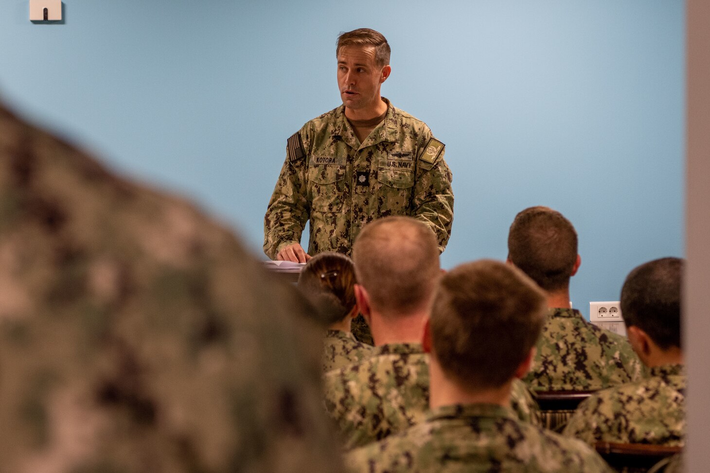 Cmdr. James Kotora, executive officer, Naval Support Activity (NSA) Souda Bay, discusses the significance of the U.S. Navy’s victory over the Japanese navy at the Battle of Midway during a commemoration event held in The Anchor on June 7, 2023.