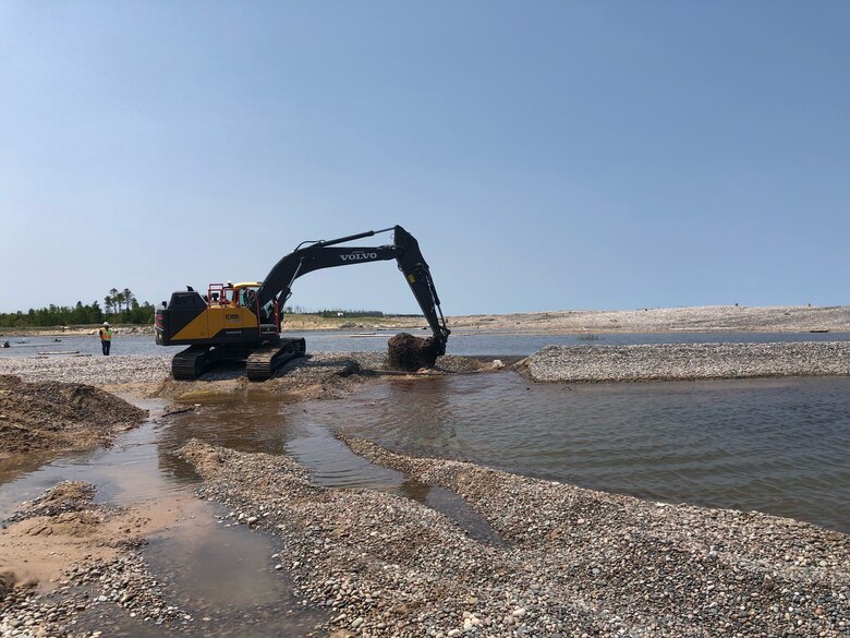 An excavator removes shoaling at Little Lake Harbor.