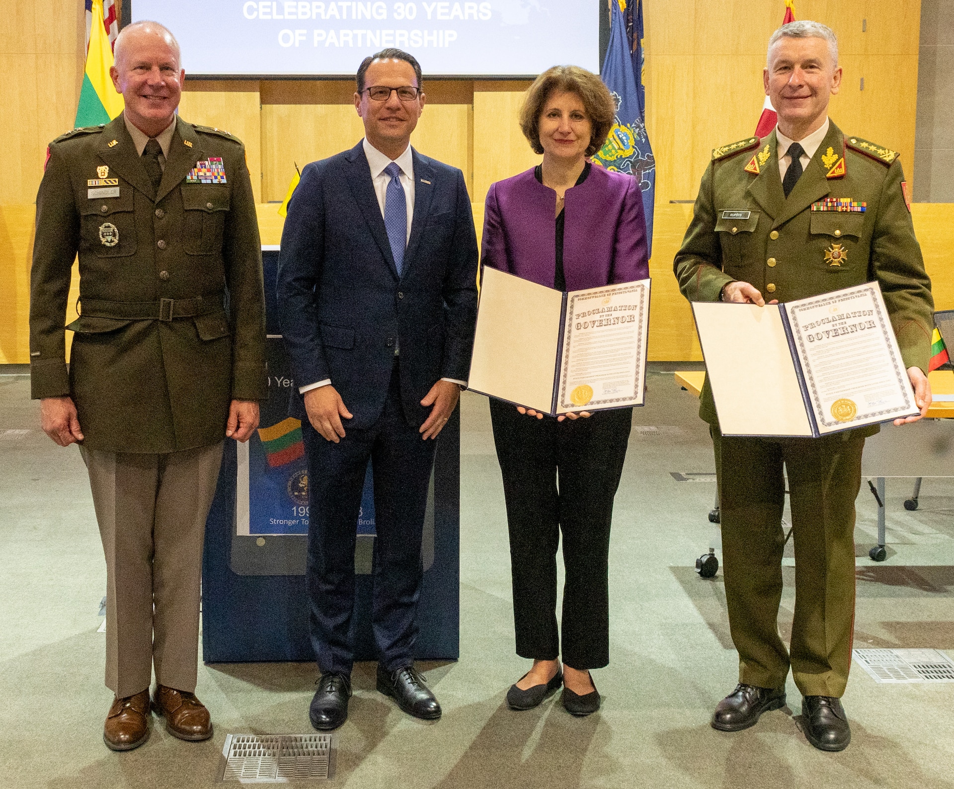 Left to right, Pennsylvania Adjutant General Maj. Gen. Mark Schindler, Pennsylvania Gov. Josh Shapiro, Lithuanian ambassador to the United States and Mexico Audra Plepytė, and Chief of Defense of the Republic of Lithuania Lt. Gen. Valdemaras Rupšys pose for a photo during a ceremony June 6 in Harrisburg to celebrate the 30-year anniversary of the partnership between the Pennsylvania National Guard and Lithuania. (Pennsylvania National Guard photo by Wayne V. Hall)