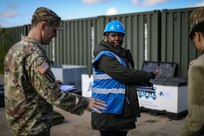 Cpt. Ed Ohalloran, battalion logistics officer, 1st Battalion, 182nd Field Artillery Regiment, goes over basic issue items [BII] for the HIMARS with Mrs. Holly Jordan, commander's responsible officer, 405th Army Field Support Battalion - Germany, 405th AFSB before he signs for the equipment for DEFENDER 23 in Adazi, Latvia on May 4, 2023.