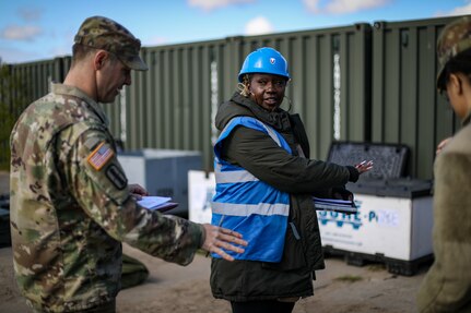 Cpt. Ed Ohalloran, battalion logistics officer, 1st Battalion, 182nd Field Artillery Regiment, goes over basic issue items [BII] for the HIMARS with Mrs. Holly Jordan, commander's responsible officer, 405th Army Field Support Battalion - Germany, 405th AFSB before he signs for the equipment for DEFENDER 23 in Adazi, Latvia on May 4, 2023.