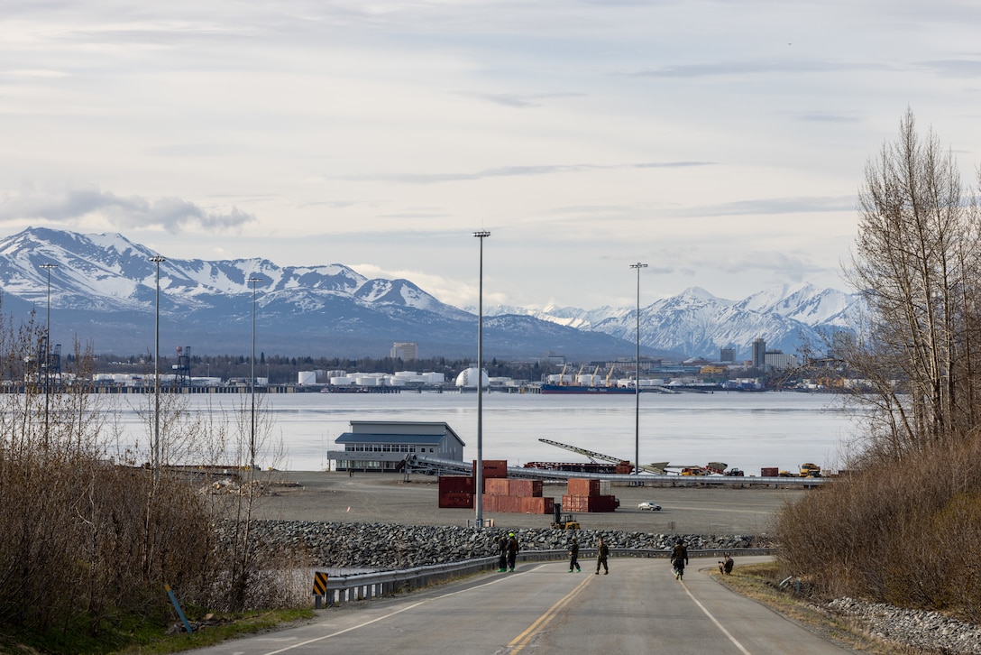 U.S. Marines with Headquarters Company, Chemical Biological Incident Response Force, walk down the road while scanning for radiation during exercise Arctic Edge 2023, Port MacKenzie, Alaska, May 15, 2023. Arctic Edge 2023 is a U.S. Northern Command-led exercise demonstrating the U.S. military's capabilities in extreme cold weather, joint force readiness and U.S. military and local homeland defense commitment to mutual strategic security interests in the Arctic region. (U.S. Marine Corps photo by Staff Sgt. Jacqueline A. Clifford)