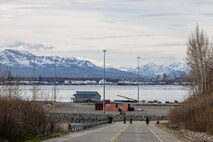 U.S. Marines with Headquarters Company, Chemical Biological Incident Response Force, walk down the road while scanning for radiation during exercise Arctic Edge 2023, Port MacKenzie, Alaska, May 15, 2023. Arctic Edge 2023 is a U.S. Northern Command-led exercise demonstrating the U.S. military's capabilities in extreme cold weather, joint force readiness and U.S. military and local homeland defense commitment to mutual strategic security interests in the Arctic region. (U.S. Marine Corps photo by Staff Sgt. Jacqueline A. Clifford)