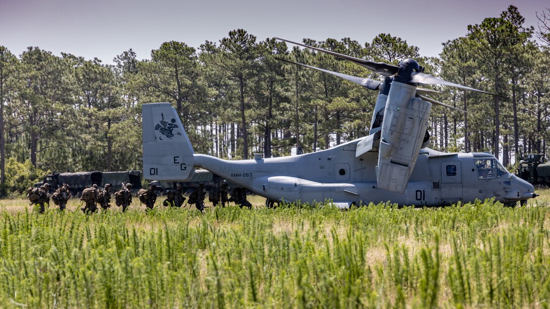 U.S. Marines with 2d Battalion, 2d Marine Regiment, 2d Marine Division boards a MV-22 Osprey during a Marine Corps Combat Readiness Evaluation (MCCRE) on Camp Lejeune, North Carolina, June 5, 2023. The MCCRE is designed to evaluate and certify a unit's comprehensive warfighting ability. (U.S. Marine Corps photo by Lance Cpl. Joshua Kumakaw)
