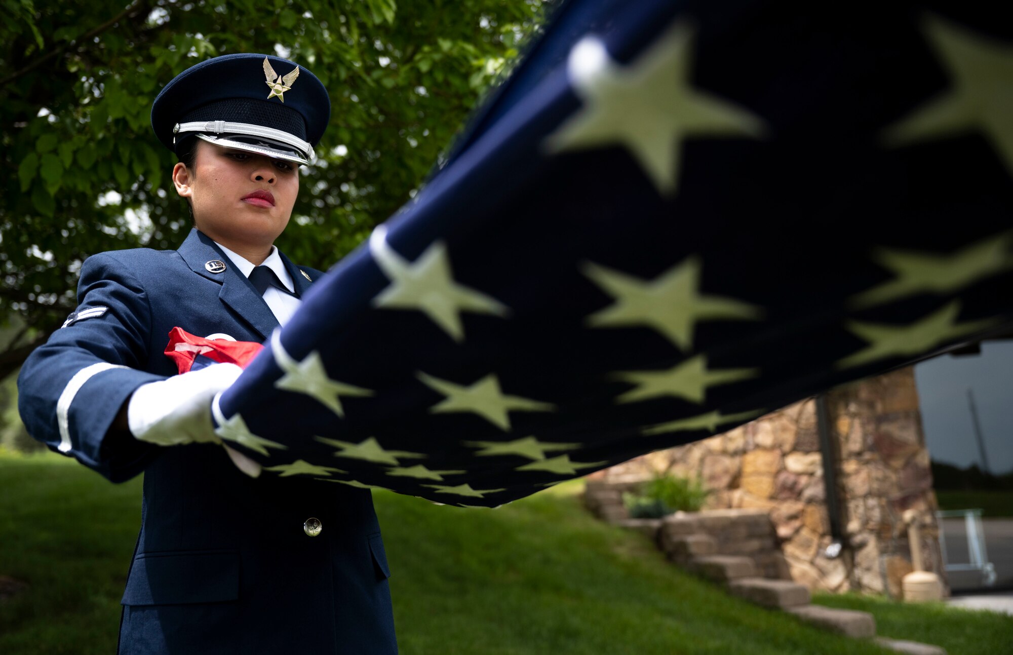 Airman 1st Class Mialani Mae Morgan, 28th Force Support Squadron ceremonial guardsman, participates in a flag fold at Black Hills National Cemetery, South Dakota, June 1, 2023.