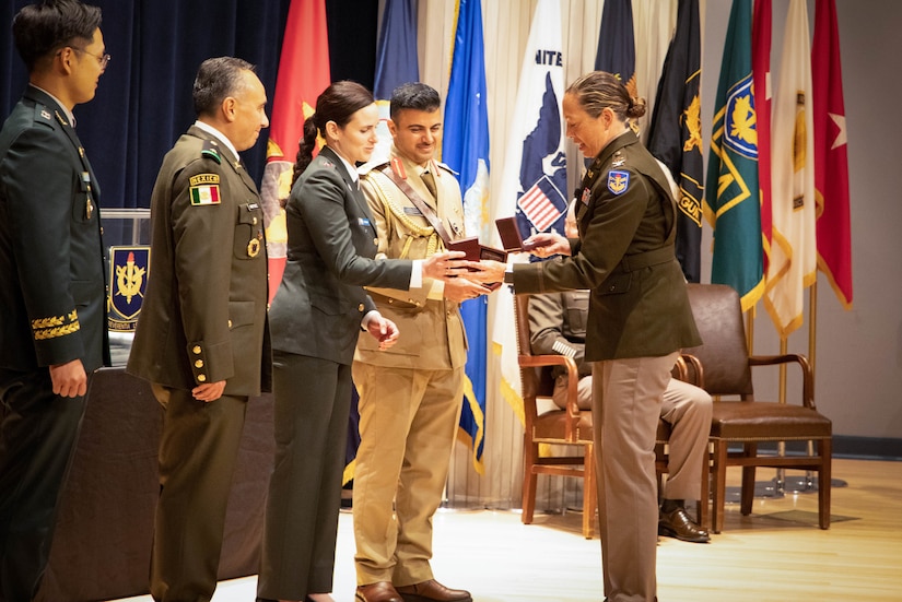 Col. Tonya L. Blackwell, The Judge Advocate General’s School dean, recognizes international military legal professionals graduating from the 71st Judge Advocate Graduate Course during a graduation ceremony at Judge Advocate General’s Legal Center and School, in Charlottesville, V.A., June 1, 2023. U.S. Army Central values active partnerships and aims to build strong relationships with partner nations. (U.S. Army photo by Sgt. Egypt Johnson)