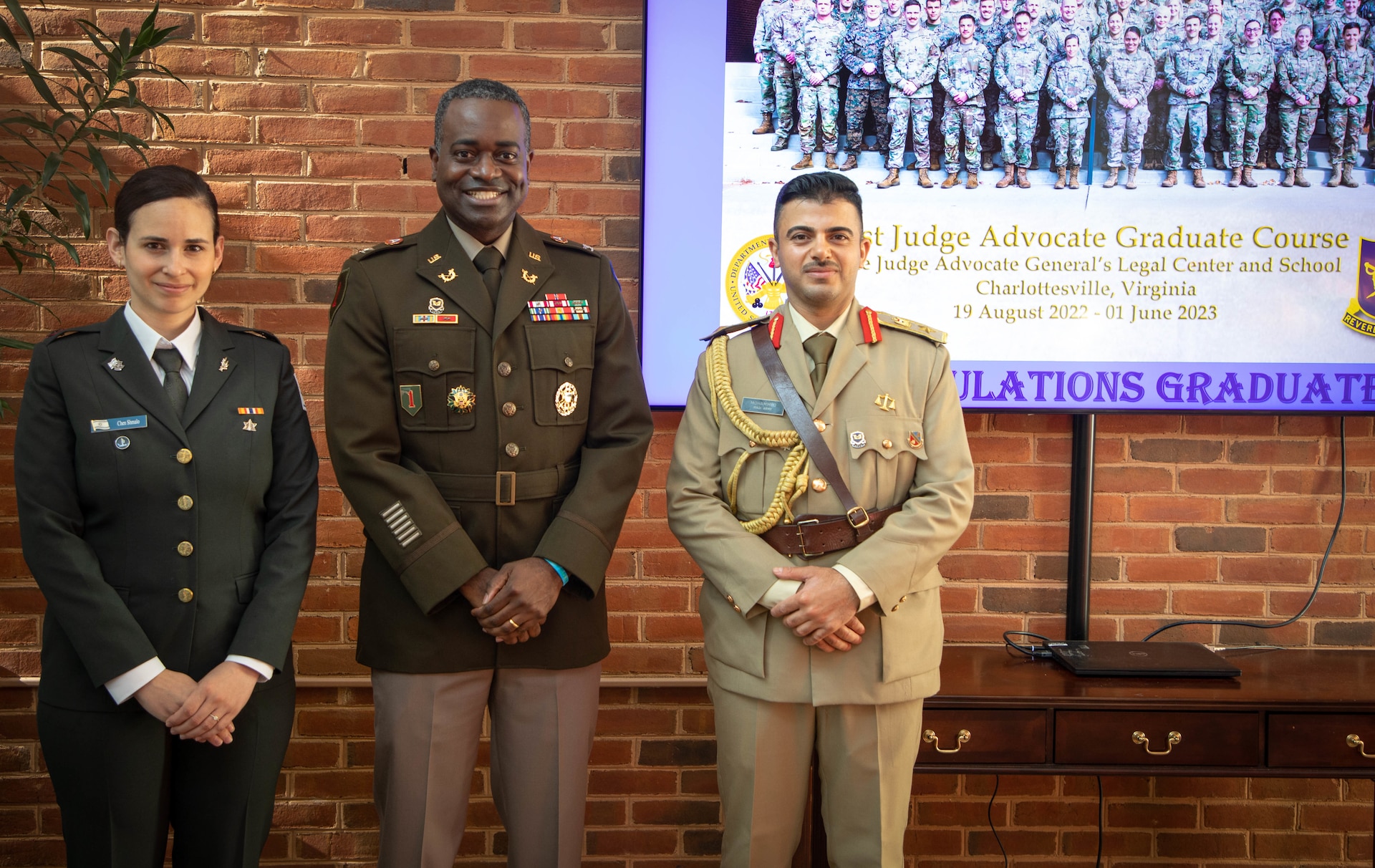 Col. Shawn Smith, U.S. Army Central staff judge advocate, visits Maj. Chen Shmallo-Mantzur, Israel Defense Forces and Lt. Col. Mohammed Hussein Agele, Iraqi Armed Forces, during their graduation from the 71st Judge Advocate Graduate Course at the Judge Advocate General’s Legal Center and School, in Charlottesville, V.A., June 1, 2023. Smith visited the Judge Advocate General’s Legal Center and School to continue engagement initiatives with the international students and build partnerships. (U.S. Army phot by Sgt. Egypt Johnson)