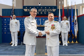 Rear Adm. Pete Garvin, commander, Naval Education and Training Command (NETC), left, receives the Distinguished Service Medal from Chief of Naval Personnel Vice Adm. Rick Cheeseman during NETC’s change of command ceremony at the National Naval Aviation Museum onboard Naval Air Station Pensacola, Florida, June 8, 2023. Rear Adm. Jeffrey Czerewko relieved Garvin and became the 21st commander of NETC. NETC's mission is to recruit, train and deliver those who serve our nation, taking them from street-to-fleet by forging civilians into highly skilled, operational and combat ready warfighters. (United States Navy photo by Mass Communication Specialist 1st Class Zachary Melvin)