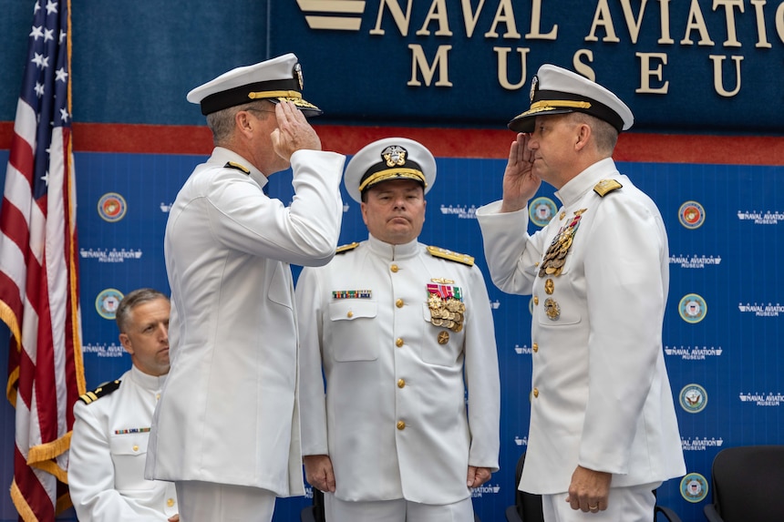 Rear Adm. Jeffrey Czerewko, right, assumes the duties and responsibilities as commander, Naval Education and Training Command (NETC) from Rear Adm. Pete Garvin during NETC’s change of command ceremony at the National Naval Aviation Museum onboard Naval Air Station Pensacola, Florida, June 8, 2023. Rear Adm. Jeffrey Czerewko relieved Garvin and became the 21st commander of NETC. NETC's mission is to recruit, train and deliver those who serve our nation, taking them from street-to-fleet by forging civilians into highly skilled, operational and combat ready warfighters. (United States Navy photo by Mass Communication Specialist 1st Class Zachary Melvin)