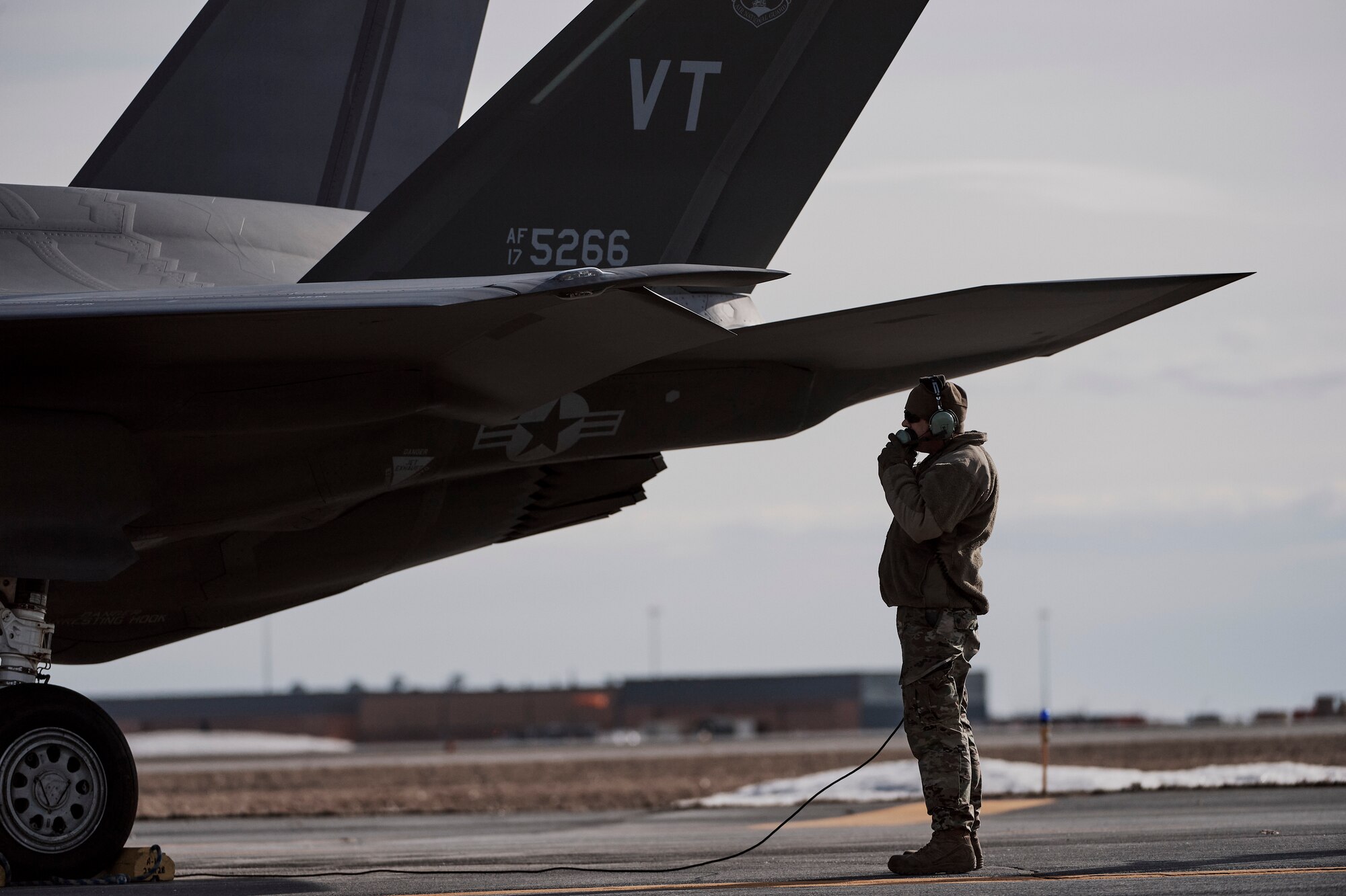 Photo of Airmen assigned to the Vermont Air National Guard's 158th Fighter Wing, from South Burlington, Vermont, preparing their F-35A Lightning II jets for a training mission at Wheeler-Sack Army Airfield , Fort Drum, New York, April 3, 2023.