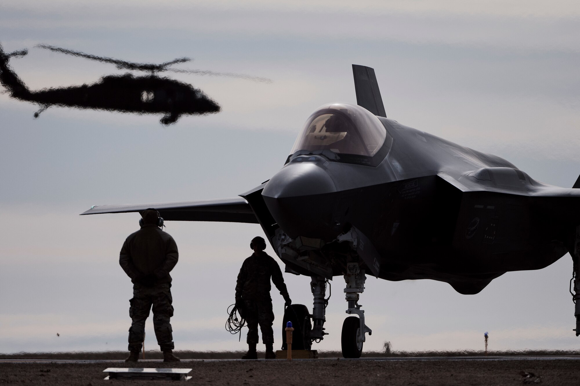 Photo of Airmen assigned to the Vermont Air National Guard's 158th Fighter Wing, from South Burlington, Vermont, preparing their F-35A Lightning II jets for a training mission at Wheeler-Sack Army Airfield , Fort Drum, New York, April 3, 2023.