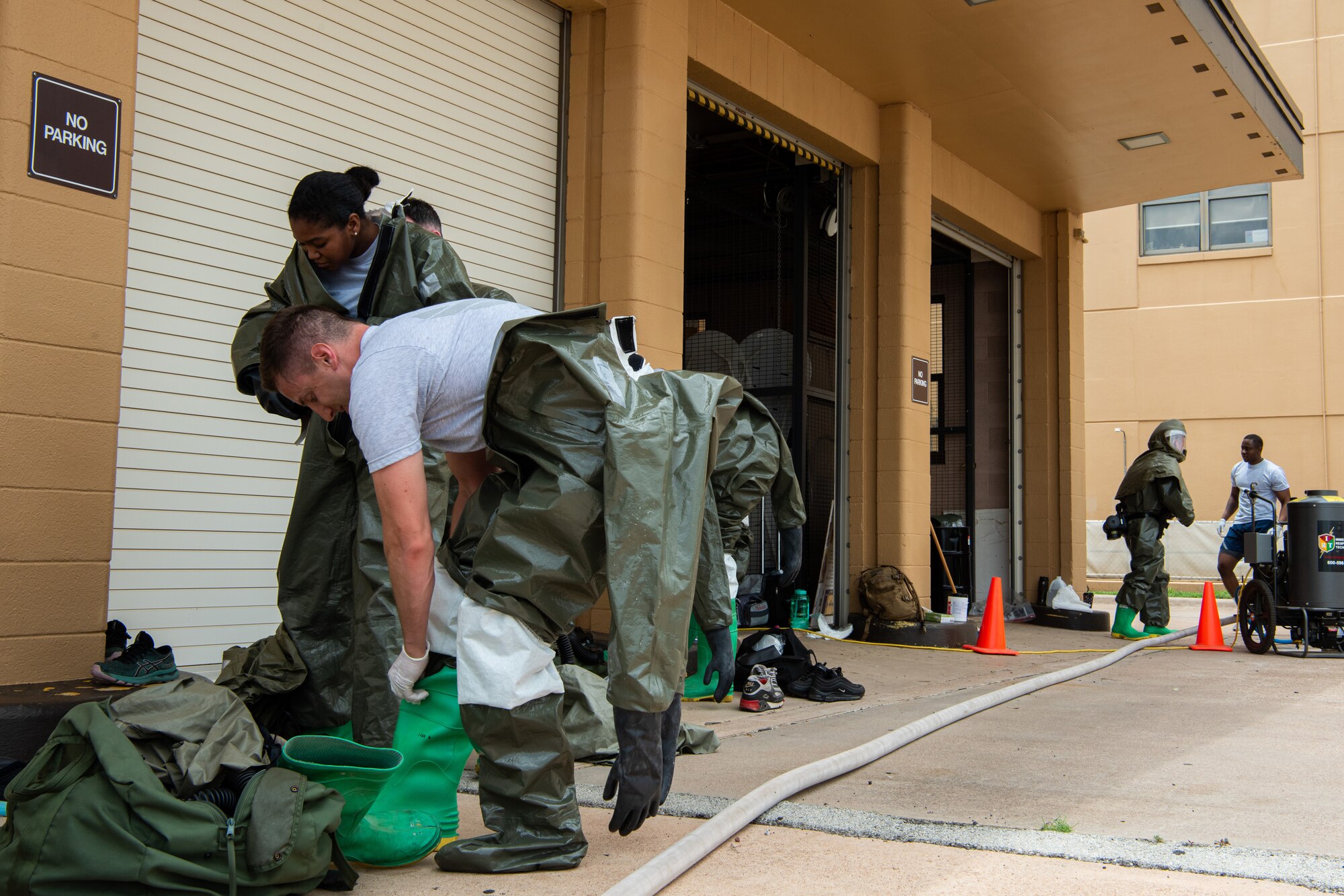 Airmen from the 7th Medical Group put on protective gear during a decontamination exercise at Dyess Air Force Base, Texas, June 1, 2023. The exercise required the completion of a three-day training course that tested Airmen’s medical disaster response. (U.S. Air Force photo by Airman 1st Class Alondra Cristobal Hernandez)