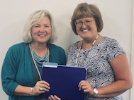 Maureen Sims-Strong was awarded the Navy Civilian Service Achievement Medal, which is the fifth highest Navy civilian award, due to her role as the Contracting Officer Representative (COR) Certification Manager (CCM).