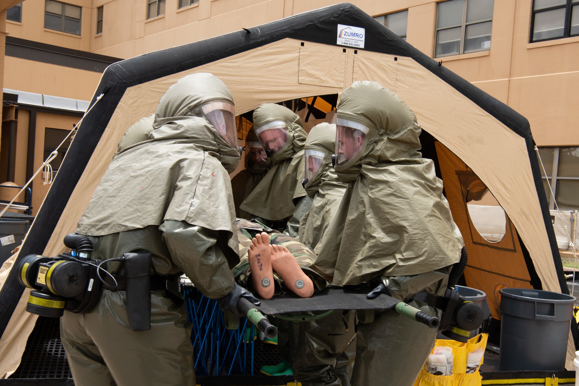 Airmen assigned to the 7th Medical Group implement decontamination procedures during an exercise at Dyess Air Force Base, Texas, June 1, 2023. The exercise required the completion of a three-day training course that tested Airmen’s medical disaster response. (U.S. Air Force photo by Airman 1st Class Alondra Cristobal Hernandez)