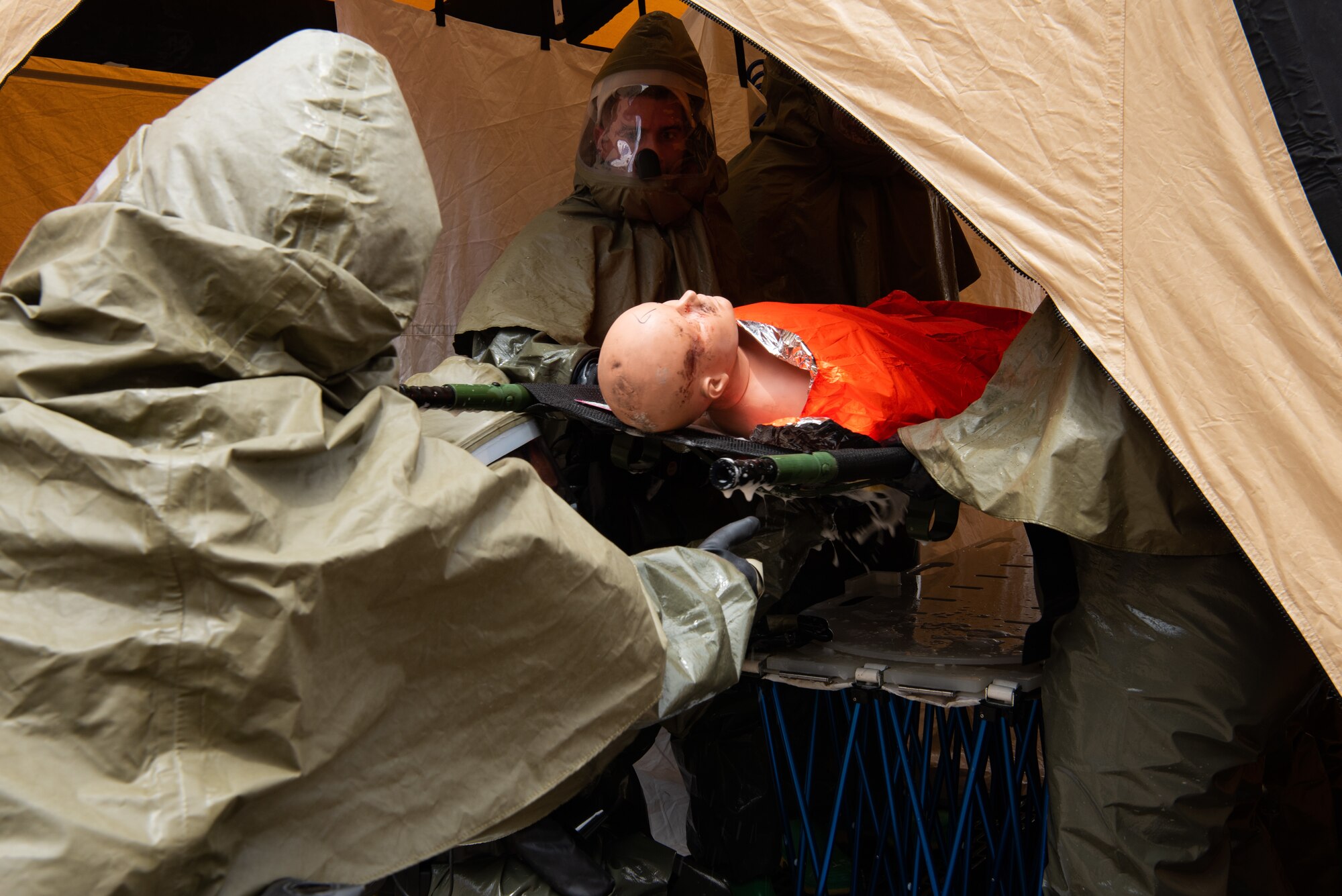 Airmen assigned to the 7th Medical Group dry off a simulated patient during a decontamination exercise at Dyess Air Force Base, Texas, June 1, 2023.The exercise required the completion of a three-day training course that tested Airmen’s medical disaster response. (U.S. Air Force photo by Airman 1st Class Alondra Cristobal Hernandez)