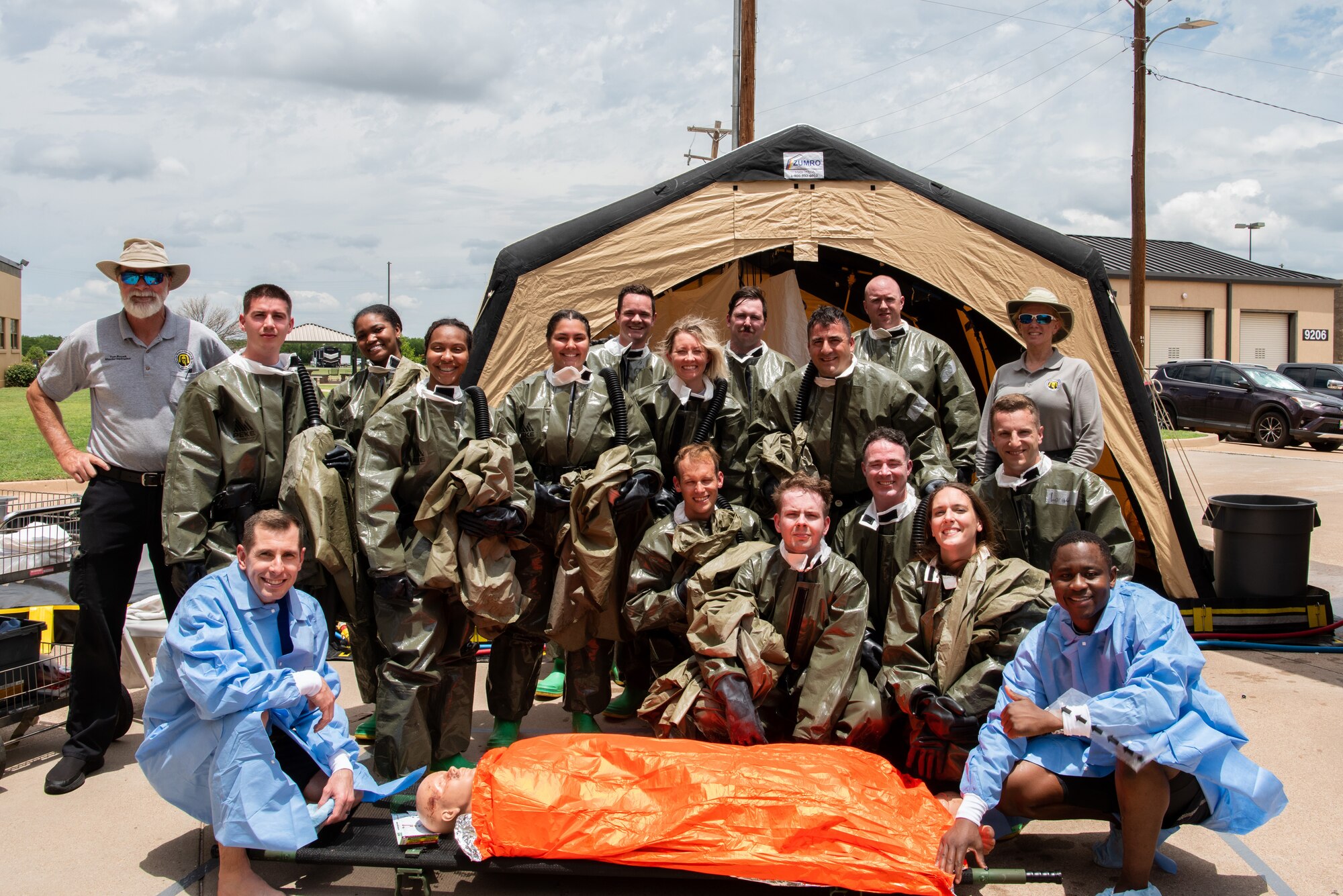 Airmen assigned to the 7th Medical Group pose after finishing their decontamination procedures exercise at Dyess Air Force Base, Texas, June 1, 2023. The exercise required the completion of a three-day training course that tested Airmen’s medical disaster response. (U.S. Air Force photo by Airman 1st Class Alondra Cristobal Hernandez)