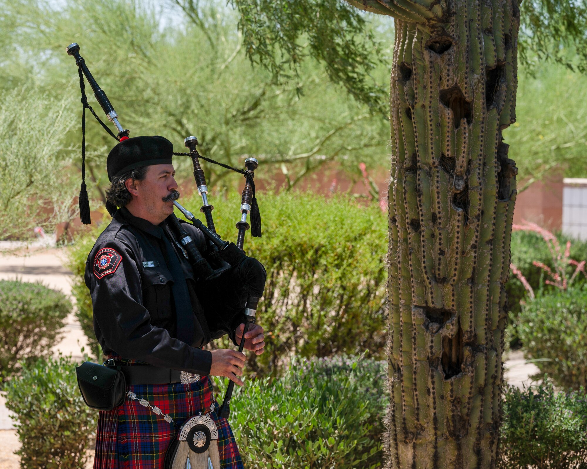 Shawn Johnson, Arizona fireman, plays the bagpipe at retired U.S. Air Force Lt. Col. Edwin “Skip” Hopler’s funeral and internment, at the National Memorial Cemetery, June 6, 2023, in Phoenix, Arizona.