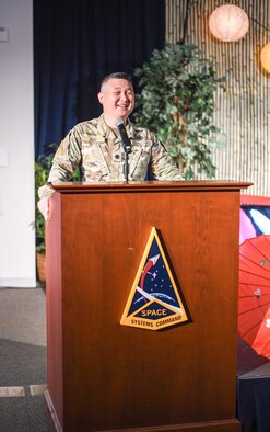 Guest speaker Lt. Col. Tan Ngo shares his personal experience coming to the U.S. from Vietnam as a young child with his family and the mentoring support he received along his military career path at the closing event for Asian American Pacific Islander Heritage Month.