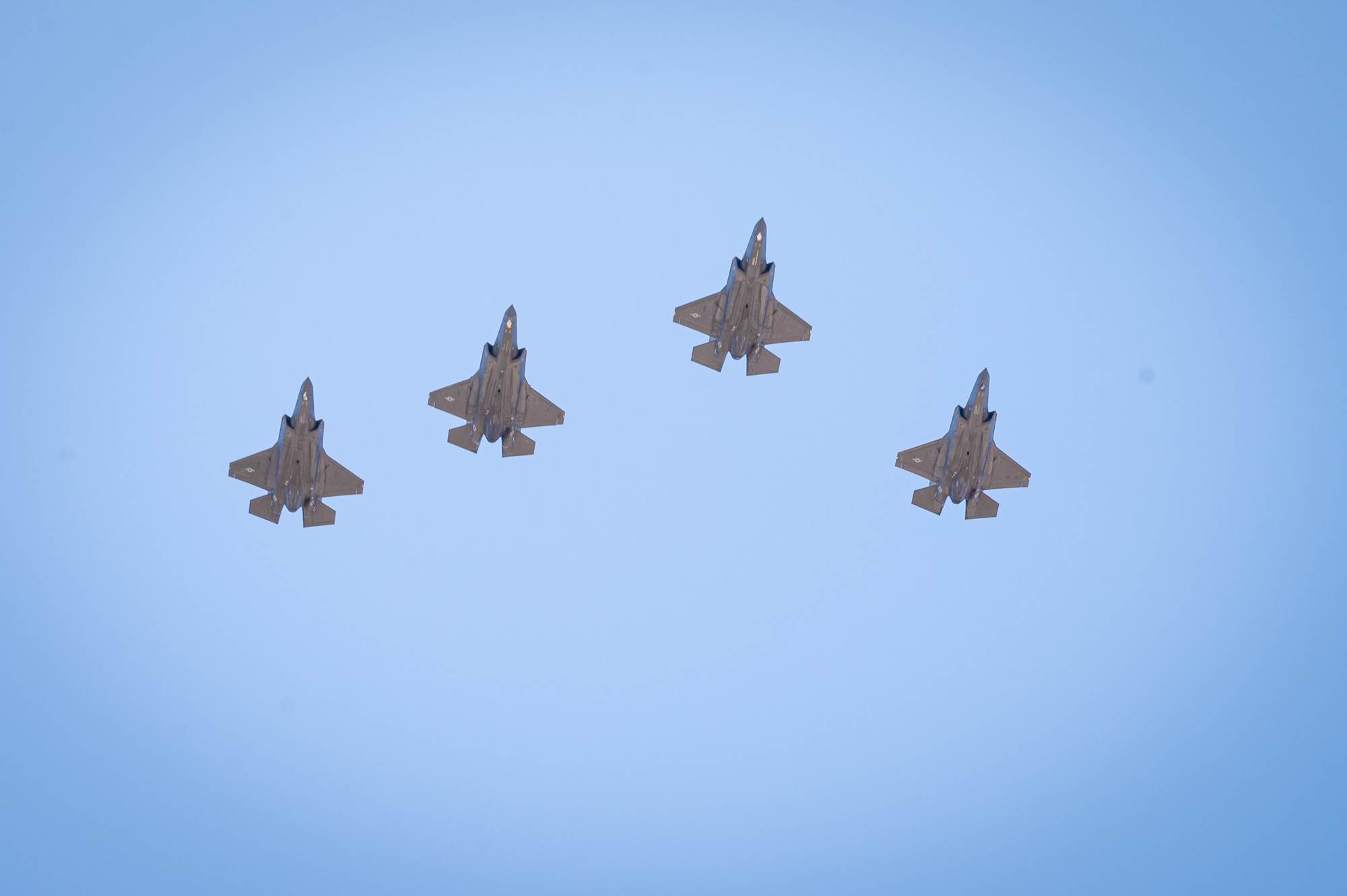 Four F-35A Lightning II aircraft assigned to the 61st Fighter Squadron conduct a flyover at retired U.S. Air Force Lt. Col. Edwin “Skip” Hopler’s funeral and internment, at the National Memorial Cemetery, June 6, 2023, in Phoenix, Arizona.