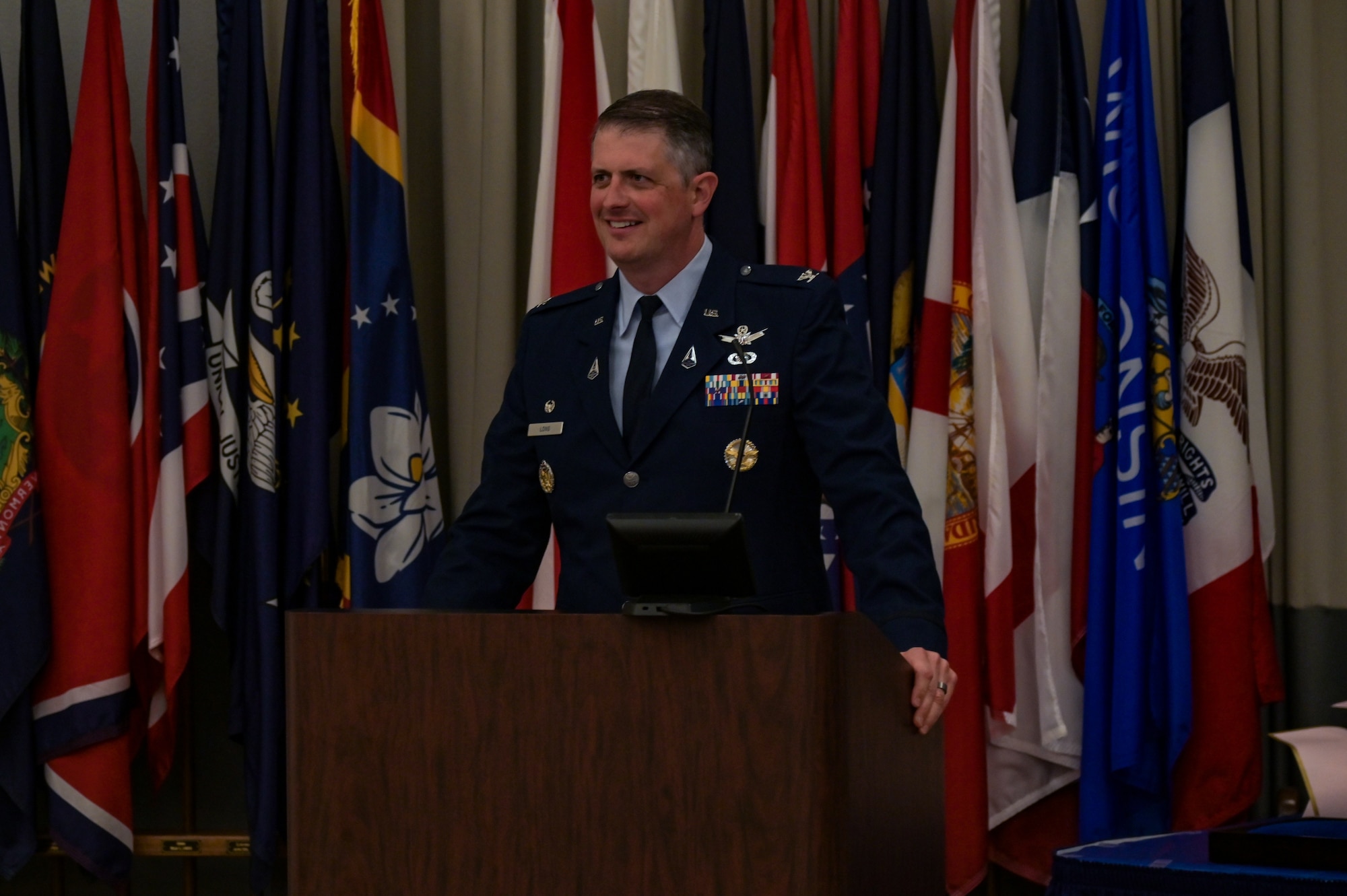 U.S. Space Force Col. Robert Long, Space Launch Delta 30 commander, speaks at the 2nd Range Operations Squadron Change of Command at the 533rd Training Squadron auditorium on Vandenberg Space Force Base, Calif., June 8, 2023. Long acknowledge the hard work and dedication of U.S. Space Force Lt. Col. Nicholas M. Somerman, outgoing 2nd Range Operations Squadron commander, and incoming 2nd Range Operations Squadron commander, U.S. Space Force Lt. Col. Darin J. Lister. (U.S. Space Force photo by Senior Airman Rocio Romo)