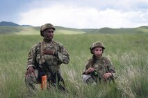 Airman 1st Class Tyrese Brewer, left, and Airman 1st Class Mahailey Cleaver, 841st Missile Security Forces Squadron missile security operators, await instruction from their team leader during a team movement exercise at Fort William Henry Harrison, Mont., May 30, 2023. The two were joined by nearly 200 other Airmen who participated in Operation Avalanche Defender, the 841st MSFS’s largest exercise yet.