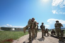 Staff Sgt. Howard Trudeau, 841st Missile Security Forces Squadron flight security controller, conducts a buddy carry on a teammate with simulated injuries during Operation Avalanche Defender at Fort William Henry Harrison, Mont., May 31, 2023. The purpose of the operation was to provide critical skillsets to the Defenders: to not stay stagnant, get control of a situation and return to offense.