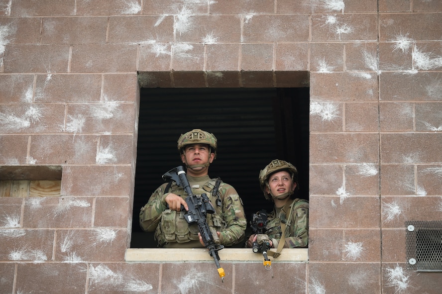 Airmen with the 841st Missile Security Forces observe a U.S. Army CH-47 Chinook as it approaches at Fort William Henry Harrison, Mont., May 31, 2023. Soldiers with the Montana National Guard provided airlift support for Operation Avalanche Defender, the 841st MSFS’s simulated deployment exercise.