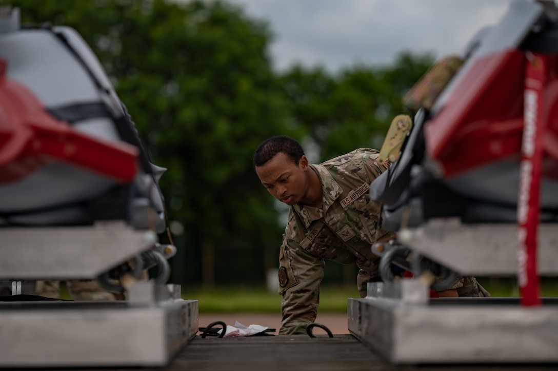 Senior Airman Romallis Lewis, 9th Expeditionary Bomb Squadron weapons load crew member, performs munitions preparation on the AGM-158 at Royal Air Force Fairford, United Kingdom, June 6, 2023.