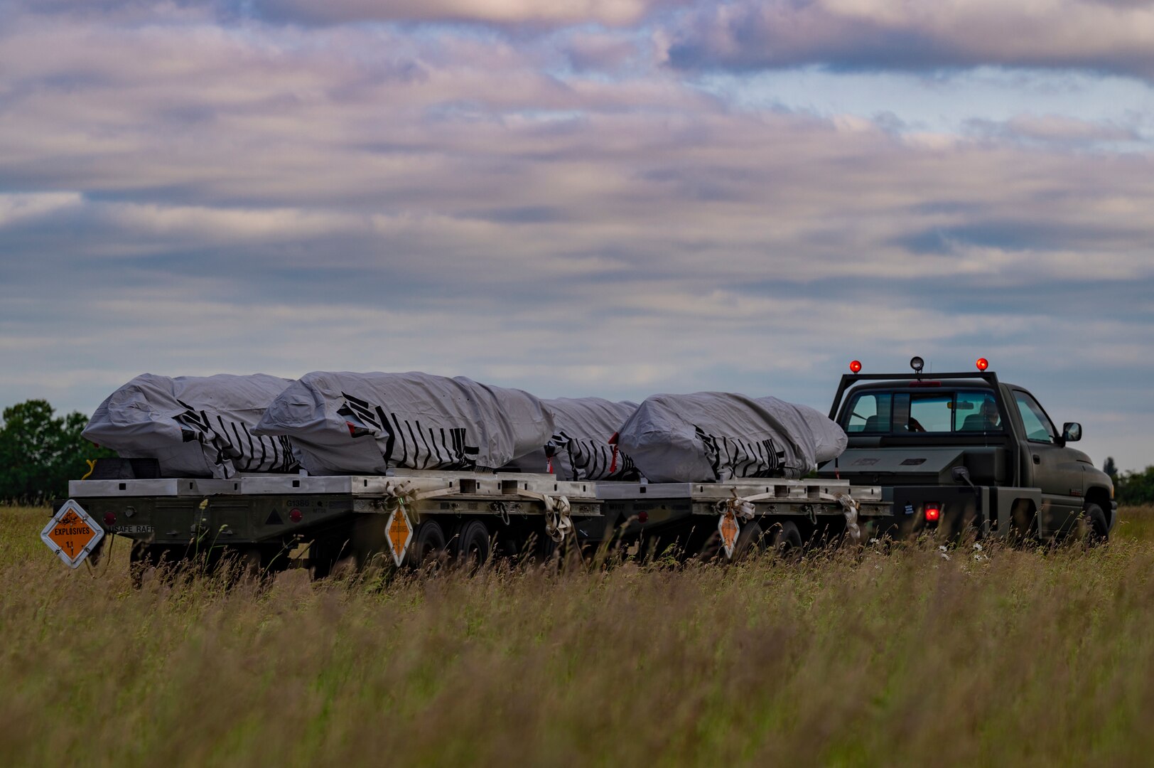 A truck transports AGM-158 live munitions to the B-1B Lancer at Royal Air Force Fairford, United Kingdom, June 6, 2023.