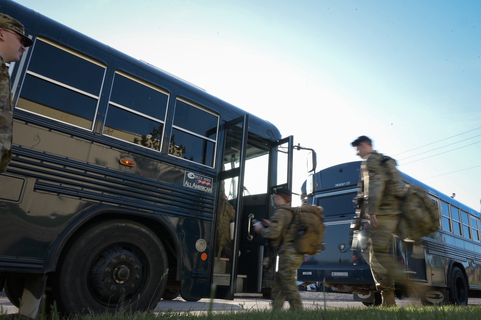 Airmen with the 841st Missile Security Forces Squadron board a bus a Malmstrom Air Force Base, Mont., May 30, 2023. The bus was a starting point for transportation to an exercise at Fort William Henry Harrison, Mont.; a U.S. Air Force C-130 Hercules, and U.S. Army UH-60 Black Hawk and CH-47 Chinook were also utilized.