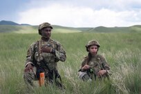Airman 1st Class Tyrese Brewer, left, and Airman 1st Class Mahailey Cleaver, 841st Missile Security Forces Squadron missile security operators, await instruction from their team leader during a team movement exercise at Fort William Henry Harrison, Mont., May 30, 2023. The two were joined by nearly 200 other Airmen who participated in Operation Avalanche Defender, the 841st MSFS’s largest exercise yet.