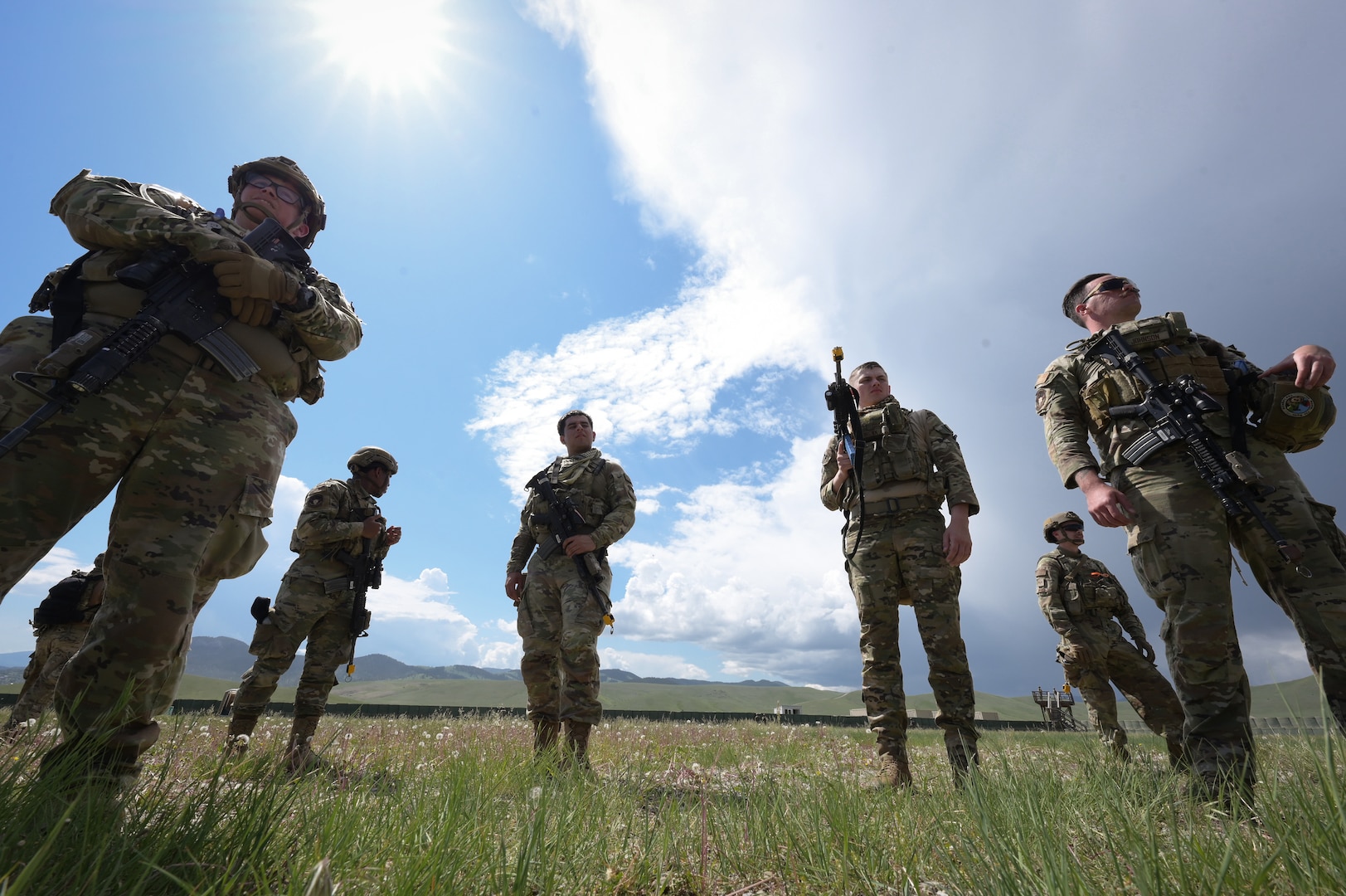 Airmen with the 841st Missile Security Forces Squadron standby for instructions from their team leader during Operation Avalanche Defender at Fort William Henry Harrison, Mont., May 31, 2023. The operation was specifically designed for the 841st MSFS, whose primary mission is to recapture and recover launch facilities spread far and spanning Montana.