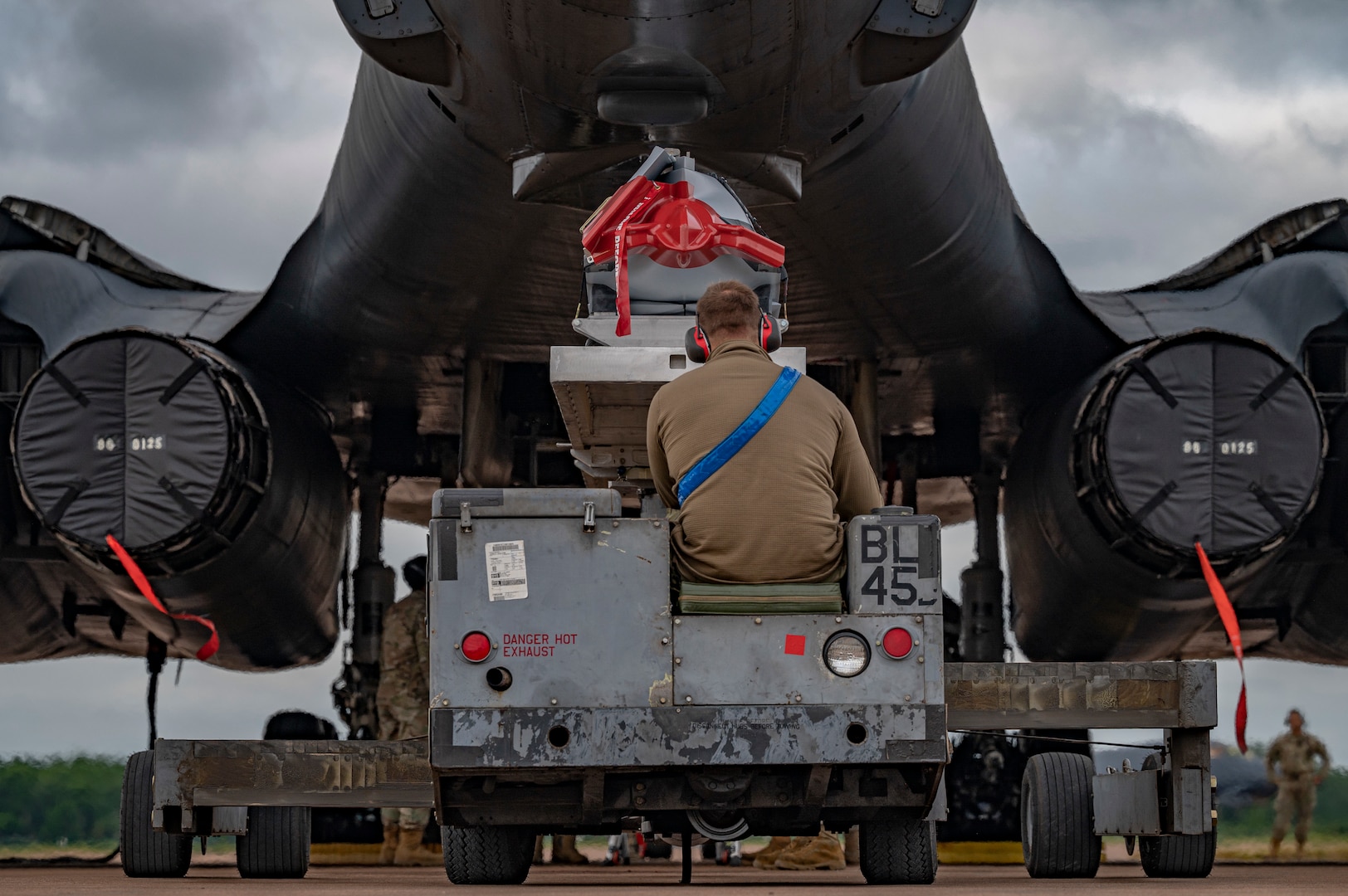 Senior Airman Joe Hance, 9th Expeditionary Bomb Squadron weapons load crew member, drives the AGM-158 into the aft weapons bay at Royal Air Force Fairford, United Kingdom, June 6, 2023.