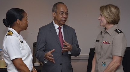 The commander of U.S. Southern Command, U.S. Army Gen. Laura Richardson, and Chief of Defence Staff of Jamaican Defense Force, Rear Adm. Antonette Wemyss-Gorman, talk with Jamaican Deputy Prime Minister and Minister of National Security, Dr. Horace Chang.