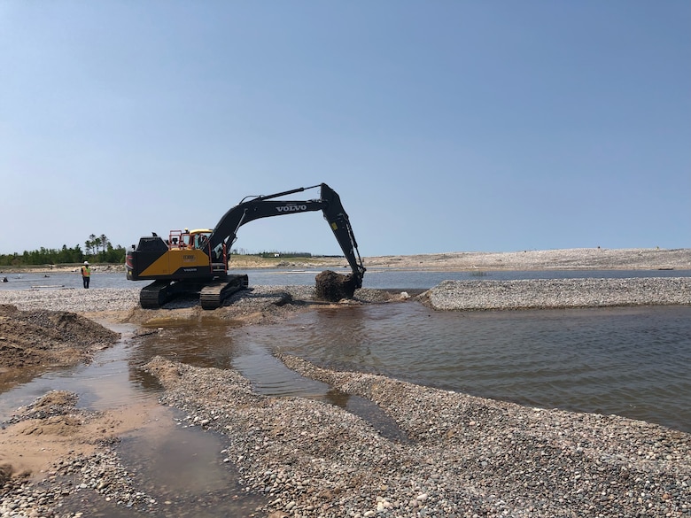 An excavator removes shoaling at Little Lake Harbor.