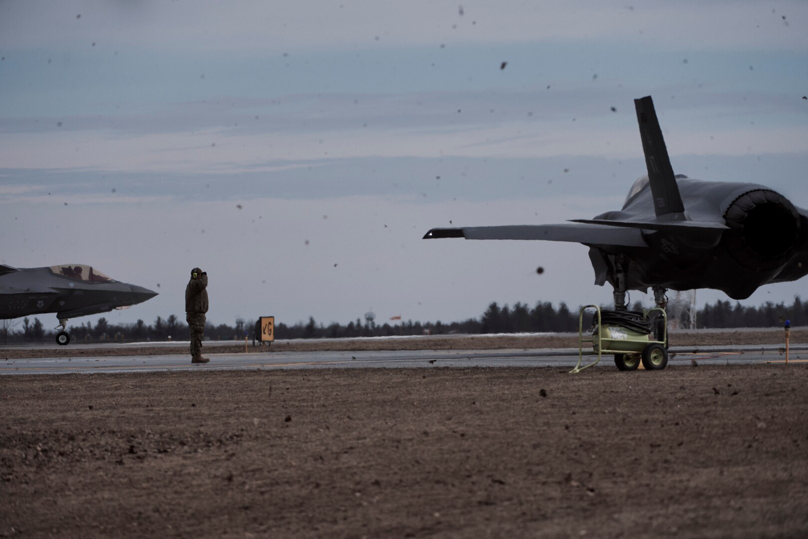 Photo of Airmen assigned to the Vermont Air National Guard's 158th Fighter Wing, from South Burlington, Vermont, launching their F-35A Lightning II jets for a training mission at Wheeler-Sack Army Airfield , Fort Drum, New York, April 3, 2023. The Airmen are participating in an Agile Combat Employment exercise which tests the wing's ability to deploy and conduct tactical missions with minimal personnel and resources. (U.S. Air National Guard photo by Master Sgt. Ryan Campbell)
