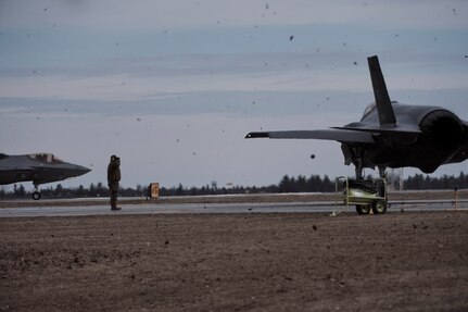 Photo of Airmen assigned to the Vermont Air National Guard's 158th Fighter Wing, from South Burlington, Vermont, launching their F-35A Lightning II jets for a training mission at Wheeler-Sack Army Airfield , Fort Drum, New York, April 3, 2023. The Airmen are participating in an Agile Combat Employment exercise which tests the wing's ability to deploy and conduct tactical missions with minimal personnel and resources. (U.S. Air National Guard photo by Master Sgt. Ryan Campbell)