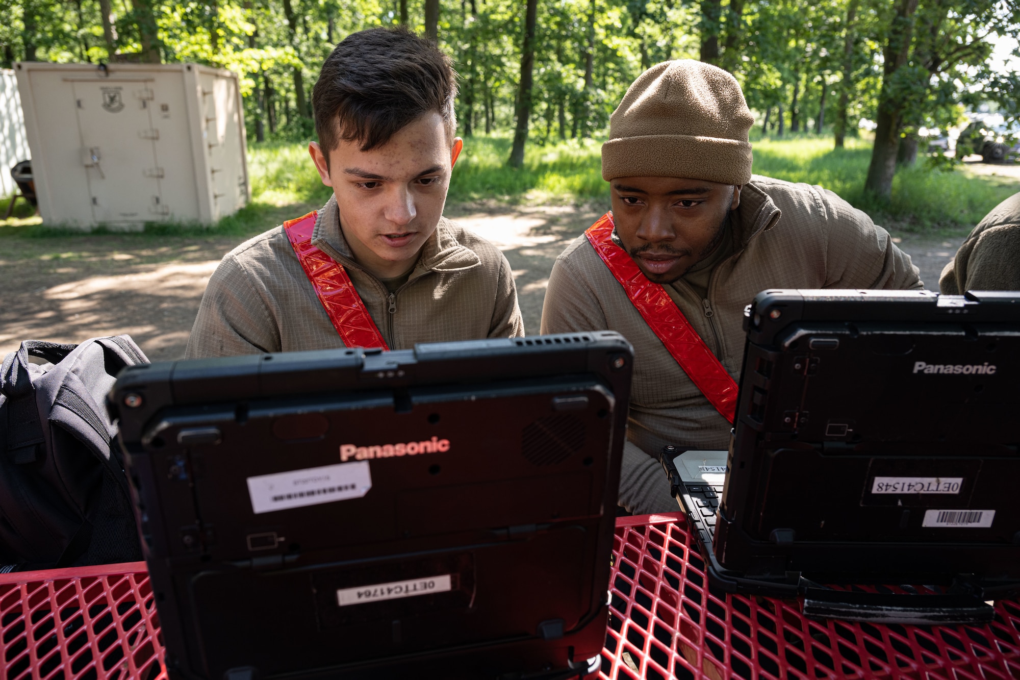 U.S. Airman 1st Class Nestor Mendoza, 480th Fighter Generation Squadron crew chief, left, and Airman 1st Class Jahvan Thom, 480th FGS crew chief, review technical orders for the day’s work