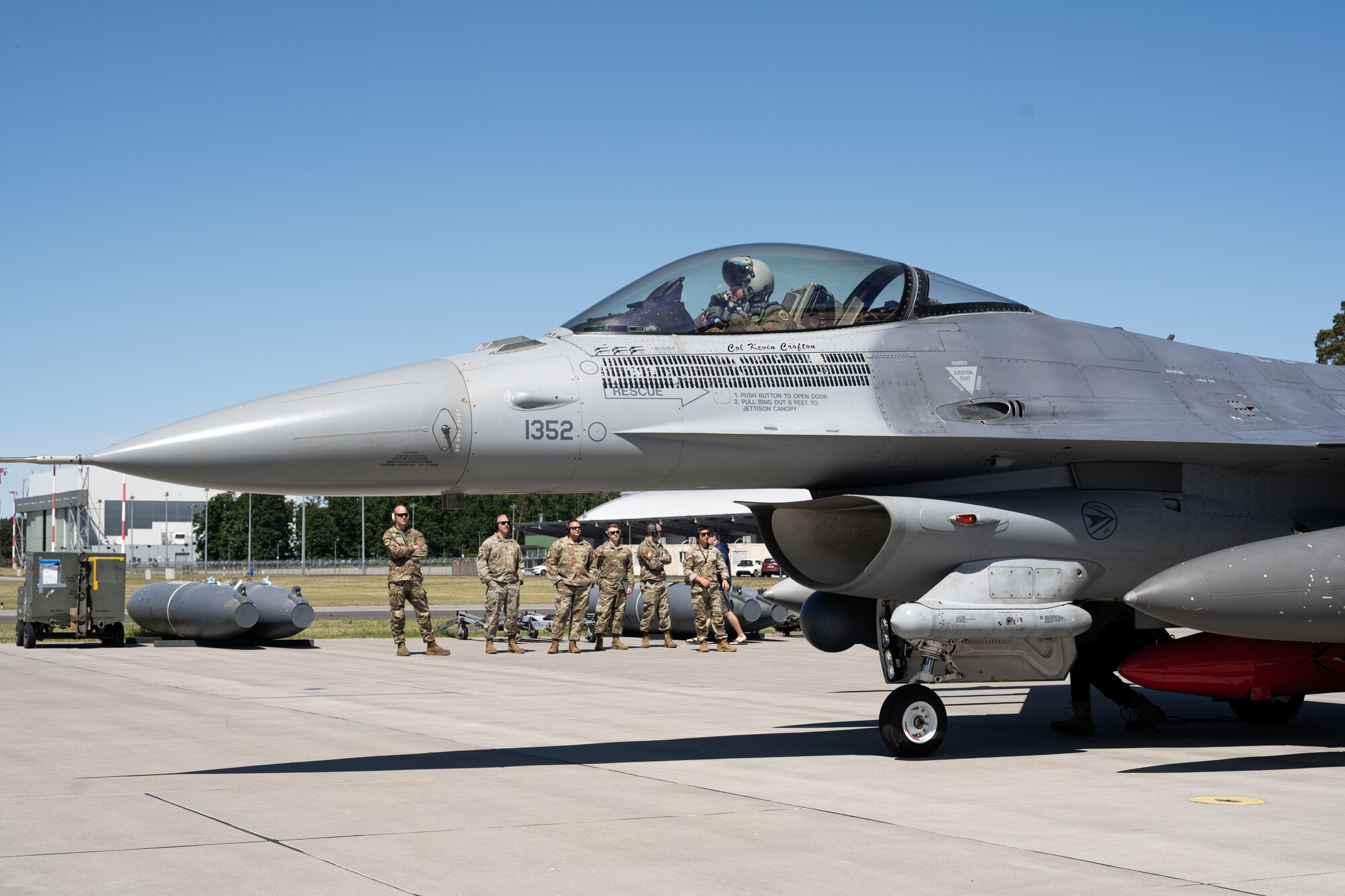 U.S. Air Force Maj. Matthew Alexander, 480th Fighter Squadron F-16 Fighting Falcon pilot, prepares to depart the aircraft upon arrival at Powidz Air Base, Poland