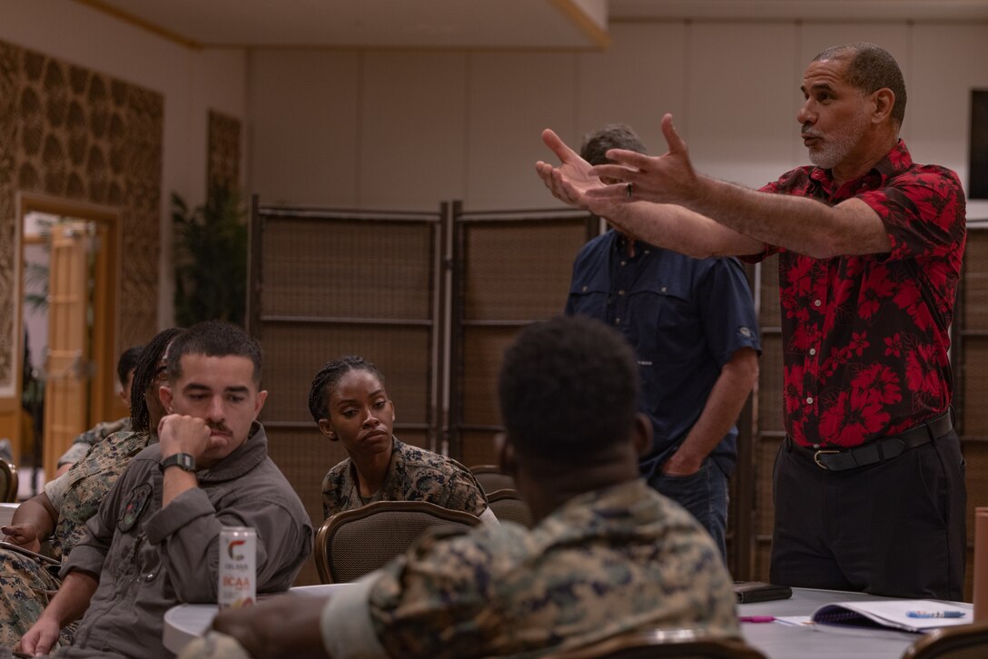 U.S. service members and civilian advocates participate in a group discussion during the 2023 Suicide Prevention Stakeholder’s Symposium on Camp Hansen, Okinawa, Japan, June 6, 2023. The symposium, now in its third iteration, brings mental health professionals and service members together to discuss critical issues and preventative measures regarding suicide. (U.S. Marine Corps photo by Cpl. Tyler Andrews)