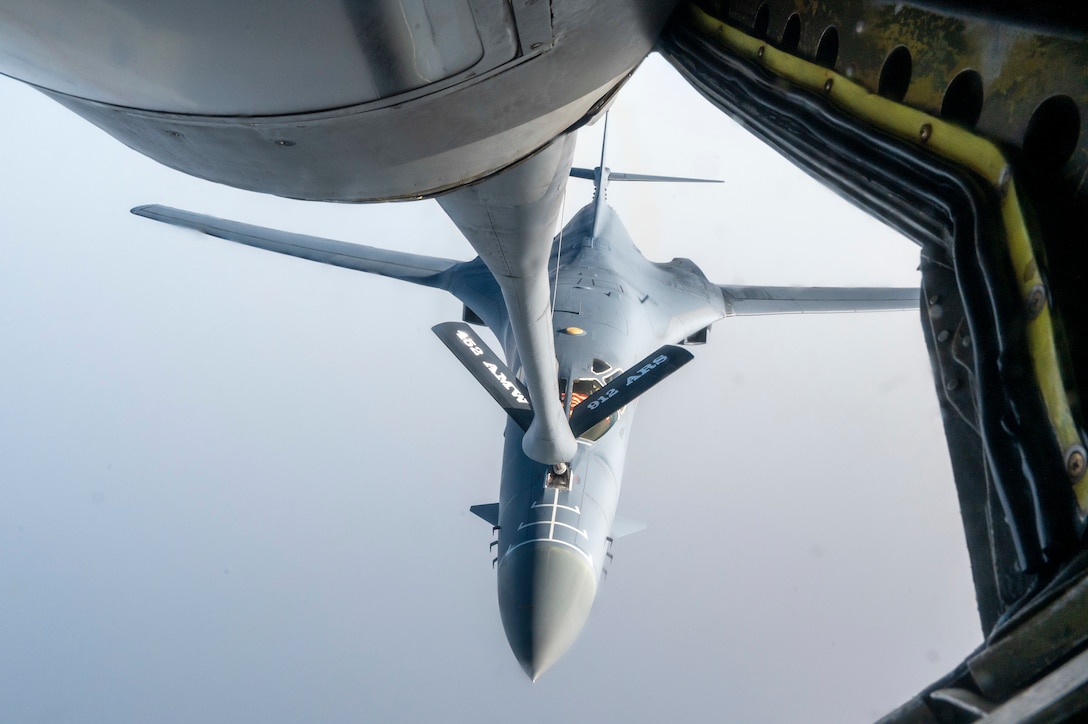A U.S. Air Force B-1 Lancer begins aerial refueling from a KC-135 Stratotanker assigned to the 912th Expeditionary Air Refueling Squadron while conducting a Bomber Task Force mission over the U.S. Central Command area of responsibility, June 8, 2023. The BTF mission was designed to build agility and interoperability between the U.S. and coalition partners while demonstrating the rapid deployment of combat power to deter regional aggression while promoting regional stability in Southwest Asia. (U.S. Air Force photo by Staff Sgt. Emily Farnsworth)